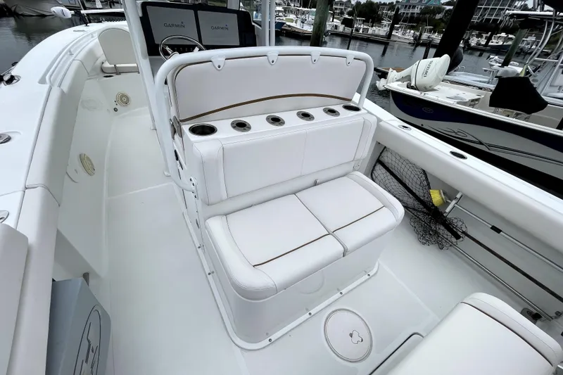 Slide: The Image of 2021 Sea Hunt Gamefish 27 boat interior with forward seating and cup holders. - 18