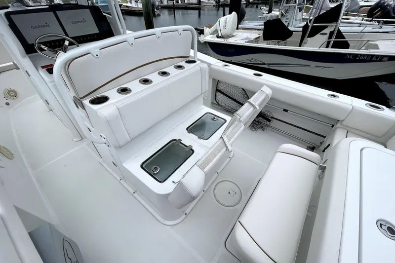 Slide: The Image of 2021 Sea Hunt Gamefish 27 boat interior with forward seating and fishing amenities. - 19
