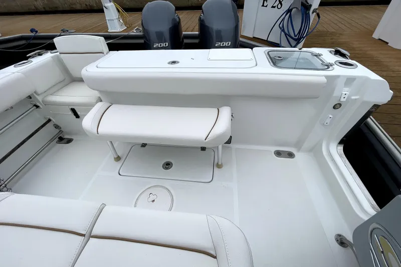 Slide: The Image of 2021 Sea Hunt Gamefish 27 boat interior with seating and dual 200 engines. - 20