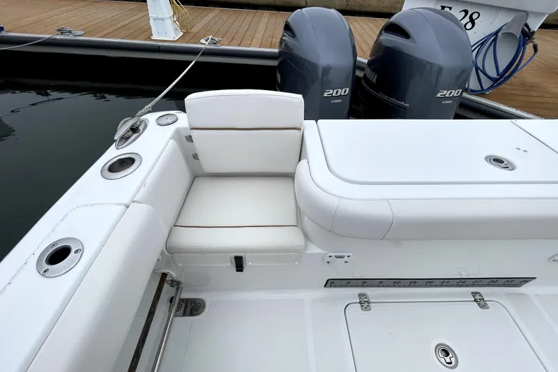 Slide: The Image of 2021 Sea Hunt Gamefish 27 boat with forward seating and twin Yamaha engines. - 22