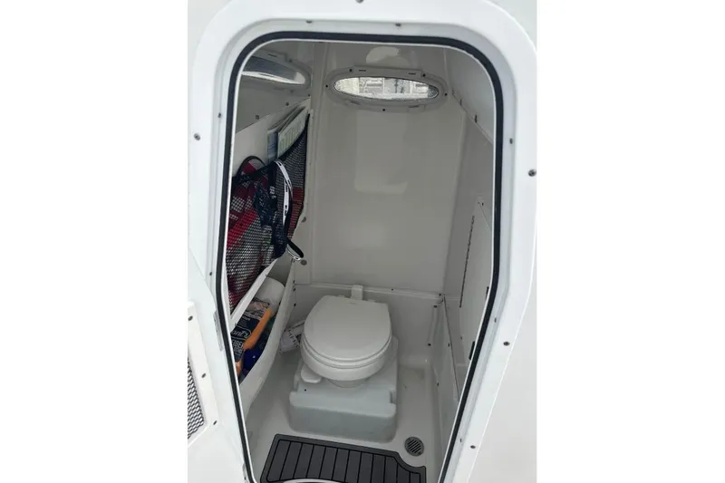 Slide: The Image of 2021 Sea Hunt Gamefish 27 Forward Seating boat docked in a marina. - 6