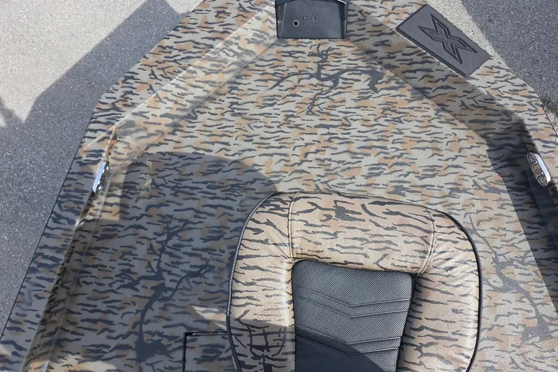 Slide: The Image of 2026 Xpress H20B Bay boat with camouflage pattern and seating detail. - 11