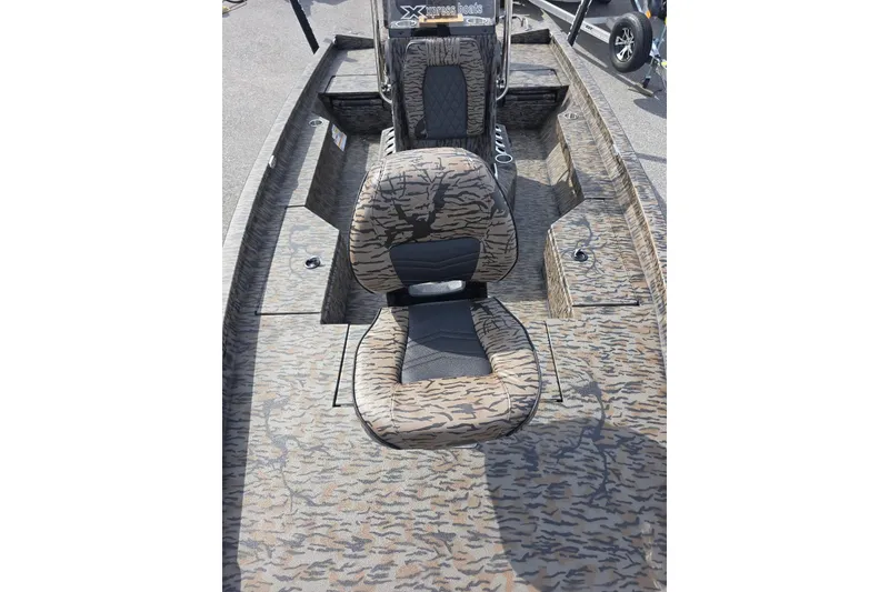 Slide: The Image of 2026 Xpress H20B Bay boat with camouflage seating and deck design. - 12