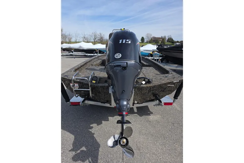 Slide: The Image of 2026 Xpress H20B Bay boat with 115 horsepower engine, parked outdoors. - 7