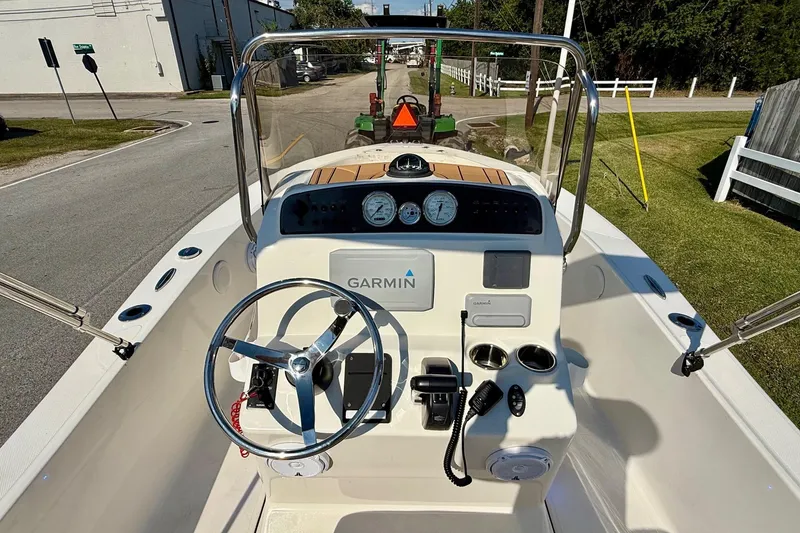 Slide: The Image of 2020 Pioneer 180 Sportfish boat dashboard with Garmin navigation system and steering wheel. - 10