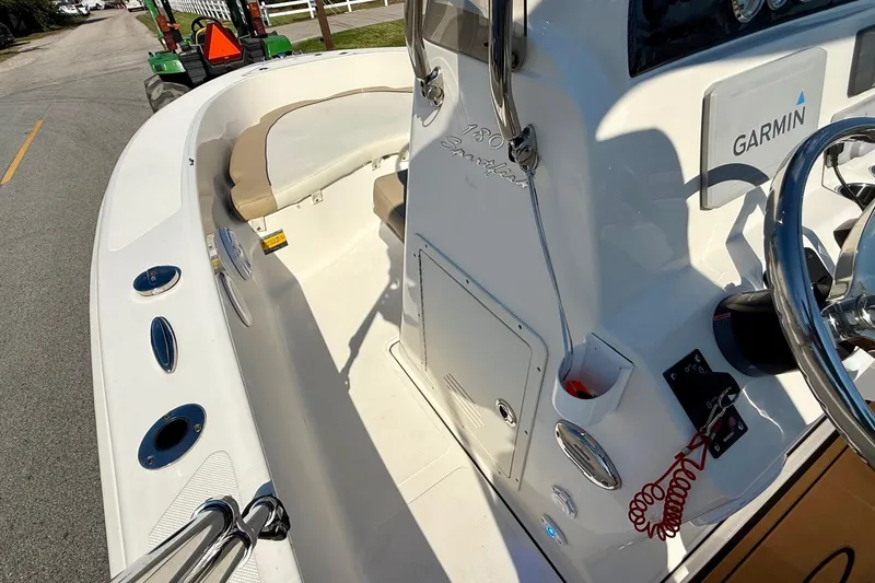 Slide: The Image of 2020 Pioneer 180 Sportfish boat interior with Garmin equipment and seating. - 11