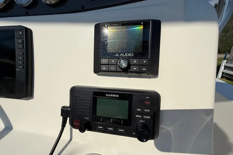 Slide: The Image of Control panel of 2020 Pioneer 180 Sportfish with JL Audio and Garmin devices. - 16