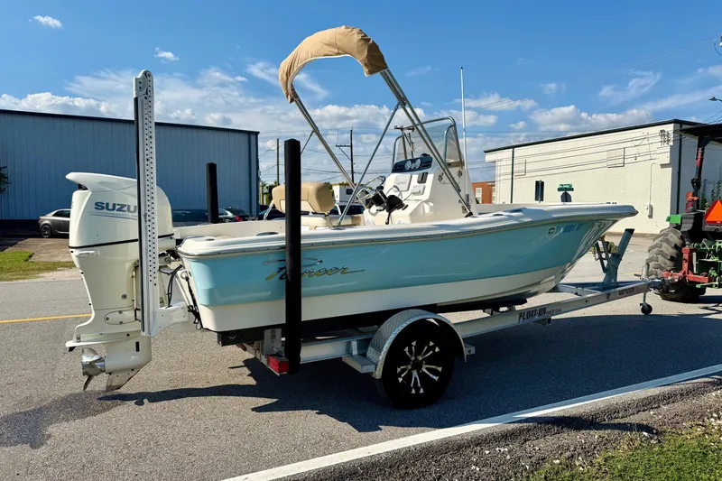Slide: The Image of 2020 Pioneer 180 Sportfish boat on trailer with Suzuki outboard motor. - 4