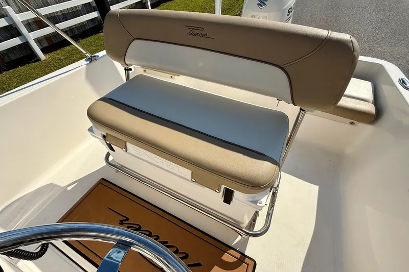 Slide: The Image of Pioneer 180 Sportfish 2020 boat seat with tan and white upholstery, Engel cooler underneath. - 9