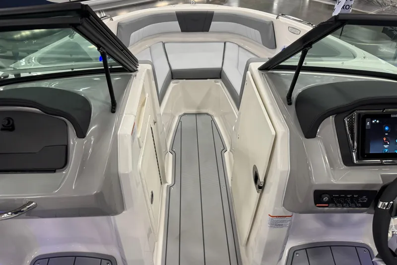 Slide: The Image of Interior view of 2026 Chaparral 21 SSi boat, featuring modern dashboard and seating. - 13