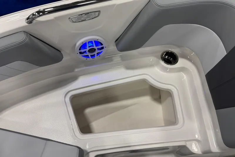 Slide: The Image of 2026 Chaparral 21 SSi boat interior with speaker and storage compartment. - 23