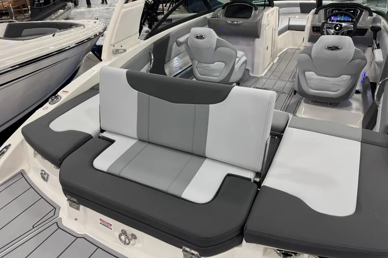 Slide: The Image of 2026 Chaparral 21 SSi boat interior with gray and white seating, modern design. - 29