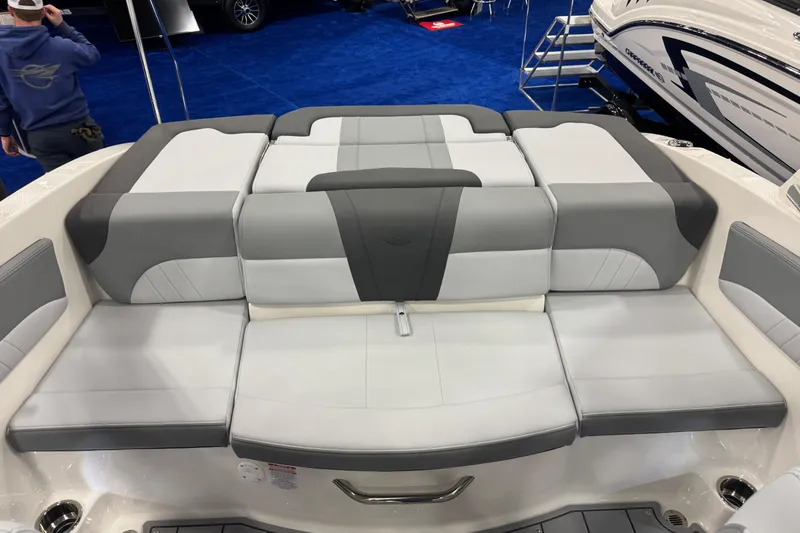 Slide: The Image of 2026 Chaparral 21 SSi boat interior with gray and white cushioned seating. - 31