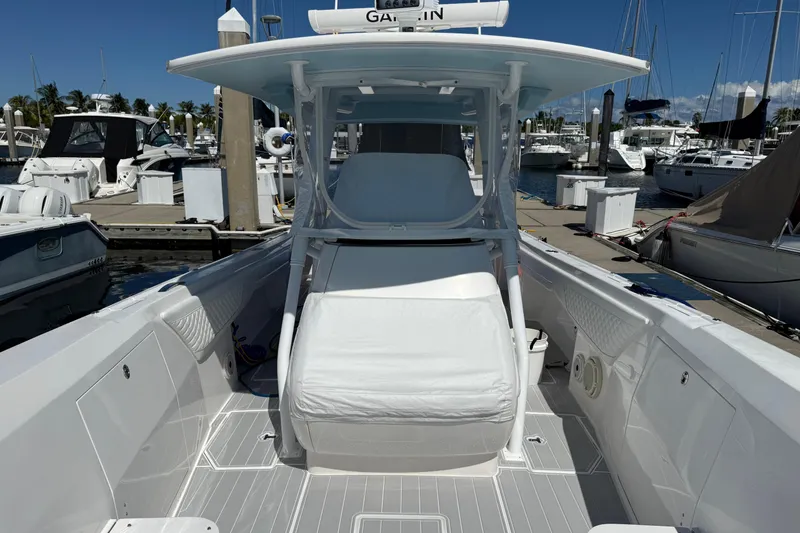 Slide: The Image of 2020 Intrepid 375 Nomad FE boat with spacious deck and modern helm at marina. - 3