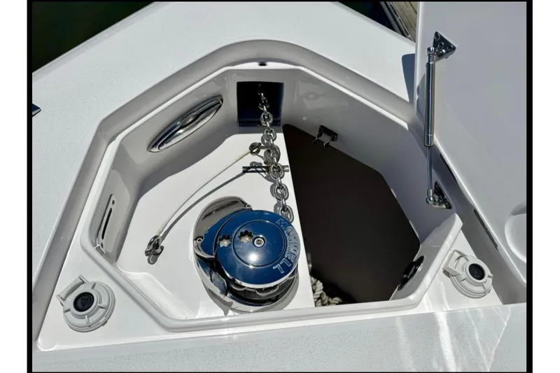 Slide: The Image of Anchor compartment of 2020 Intrepid 375 Nomad FE boat, featuring a windlass system. - 7