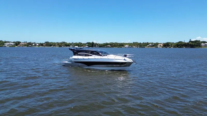 Slide: The Image of 2025 Real 40 HT Luxury yacht cruising on a sunny day. - 18