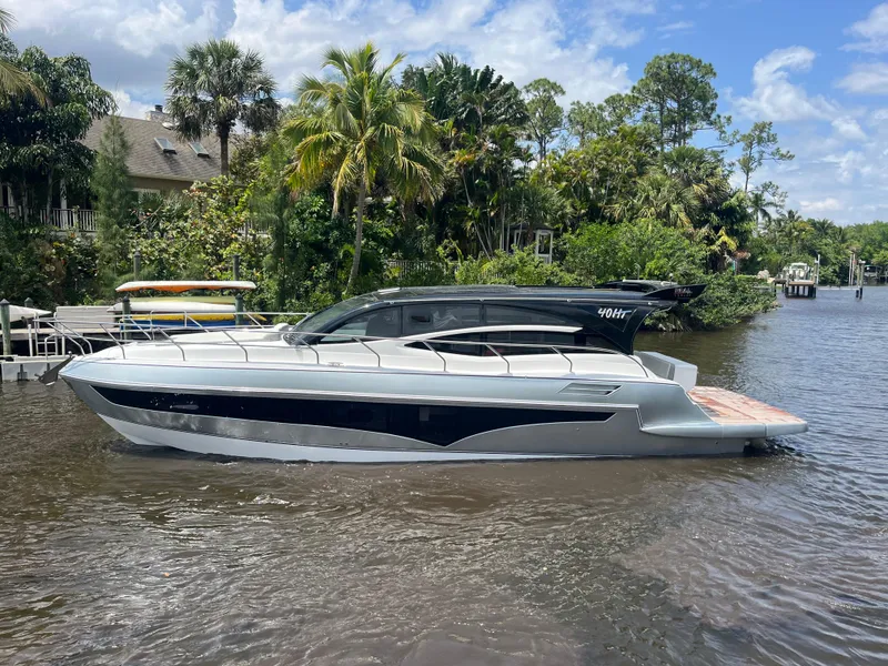 Slide: The Image of Luxury 2025 Real 40 HT yacht on a scenic river with lush greenery. - 30