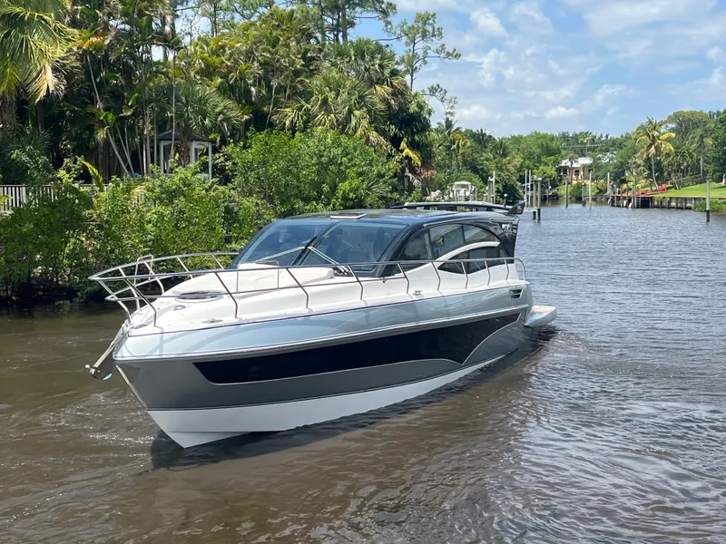 Slide: The Image of 2025 Real 40 HT Luxury yacht cruising on a scenic river. - 31