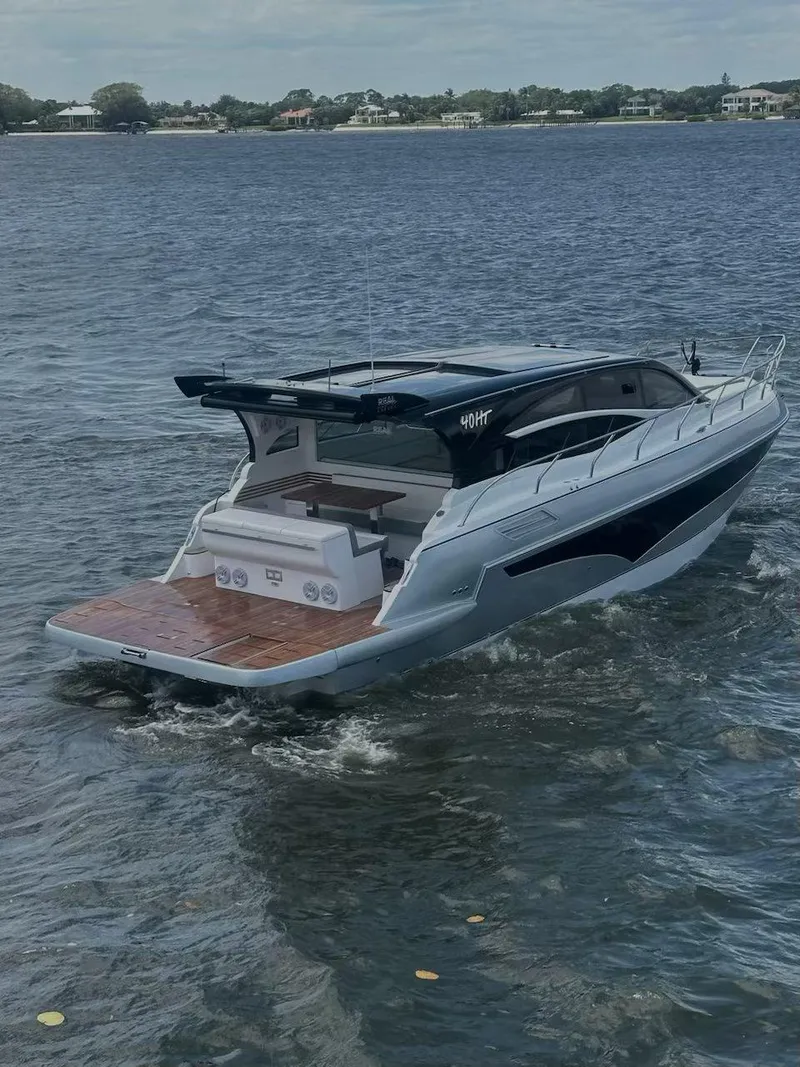 Slide: The Image of 2025 Real 40 HT Luxury yacht cruising on a serene lake. - 33