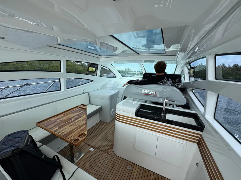 Slide: The Image of Luxurious interior of 2025 Real 40 HT yacht with modern design and panoramic windows. - 35