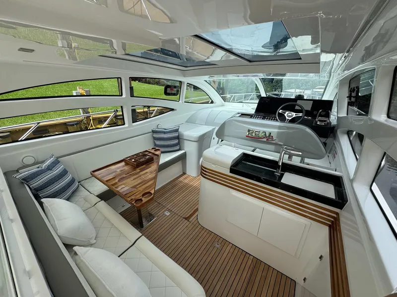 Slide: The Image of Luxurious interior of 2025 Real 40 HT yacht with elegant seating and modern helm. - 39