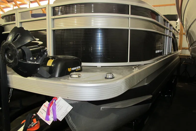 Slide: The Image of 2022 Bennington SX 22 Fishing boat with Minn Kota trolling motor in showroom. - 1