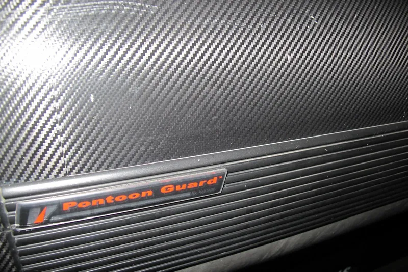 Slide: The Image of Carbon fiber texture with "Pontoon Guard" label on 2022 Bennington SX 22 Fishing boat. - 10