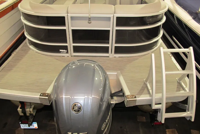 Slide: The Image of 2022 Bennington SX 22 Fishing boat with Yamaha outboard motor and swim ladder. - 3