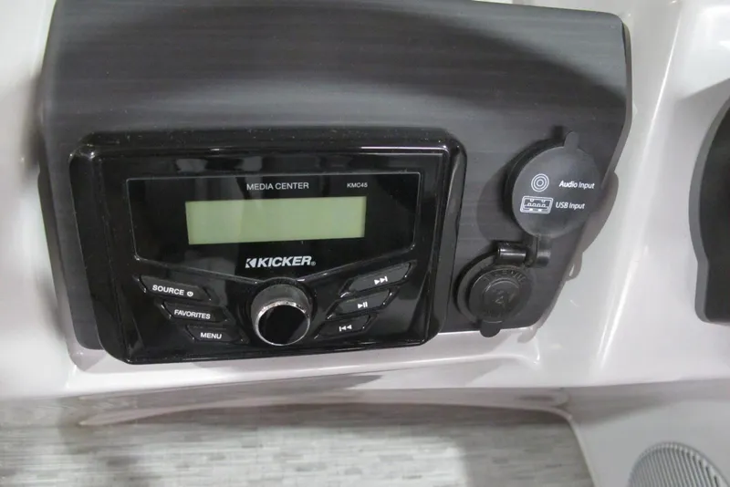 Slide: The Image of Kicker media center on 2022 Bennington SX 22 Fishing boat dashboard with audio and USB inputs. - 8