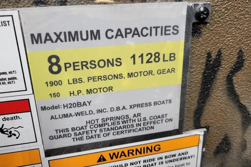 Slide: The Image of 2026 Xpress H20B Bay boat interior with patterned seats and deck design. - 15