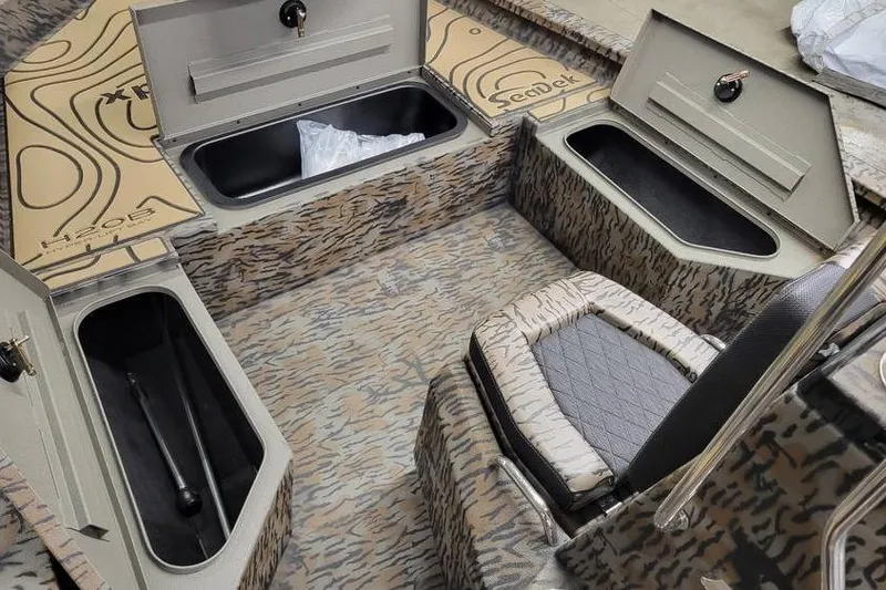 Slide: The Image of 2026 Xpress H20B Bay boat with Yamaha engine on a trailer. - 7