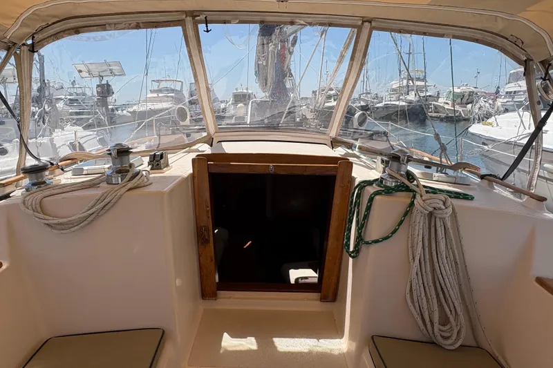 Slide: The Image of Cockpit view of a 1995 Island Packet 40 sailboat docked in a marina. - 19