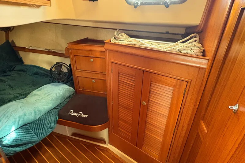 Slide: The Image of Cozy cabin interior of 1995 Island Packet 40 sailboat with wooden cabinetry. - 39