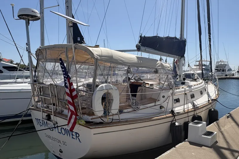 Slide: The Image of Sailboat docked at marina, 1995 Island Packet 40, Charleston, SC, with American flag. - 5