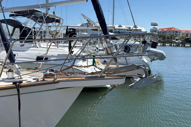 Slide: The Image of Sailboats docked at marina, featuring a 1995 Island Packet 40. - 7