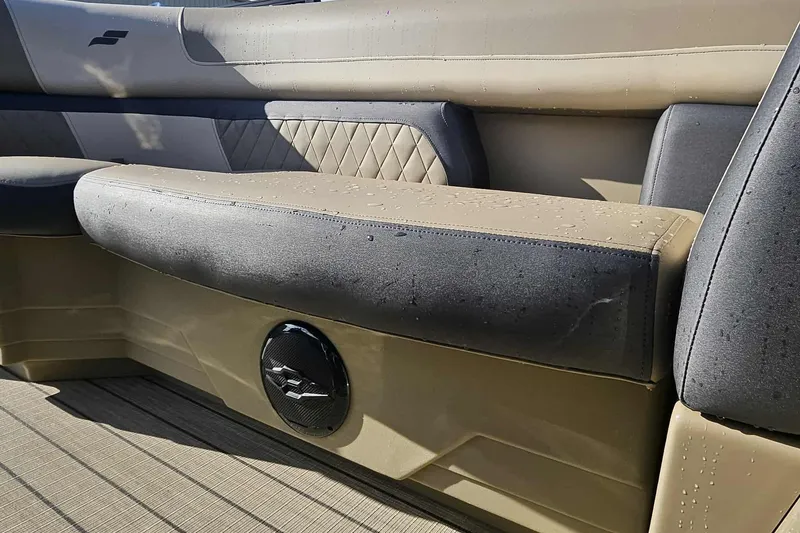 Slide: The Image of 2026 Starcraft EXS 3 Q DH boat interior with cushioned seating and speaker. - 13