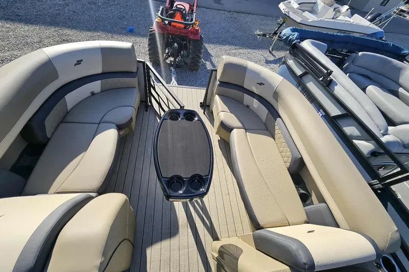 Slide: The Image of 2026 Starcraft EXS 3 Q DH pontoon boat with spacious seating and central table. - 15