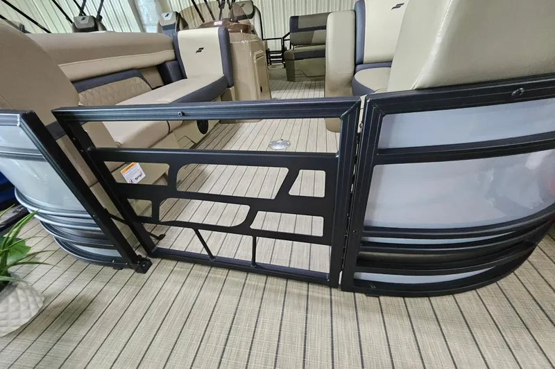 Slide: The Image of Interior view of 2026 Starcraft EXS 3 Q DH pontoon boat with seating and gate. - 16