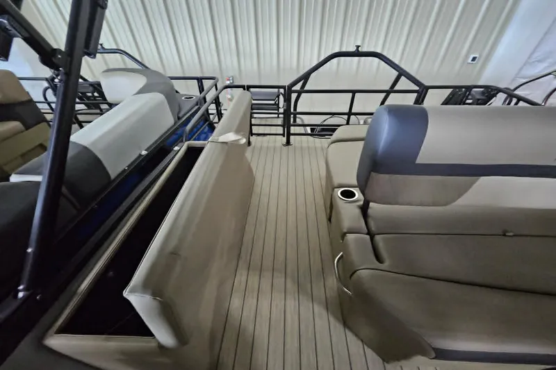 Slide: The Image of 2026 Starcraft EXS 3 Q DH boat interior with beige seating and sleek design. - 19