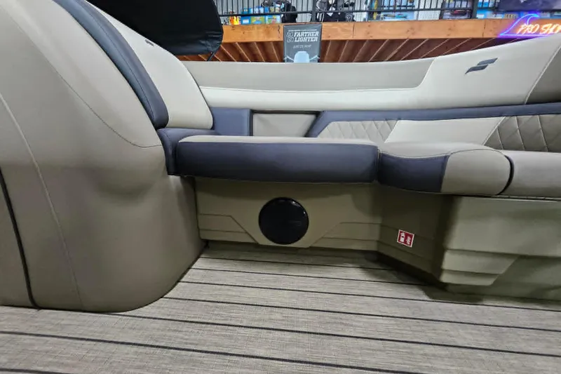 Slide: The Image of 2026 Starcraft EXS 3 Q DH boat interior with beige and gray seating. - 22