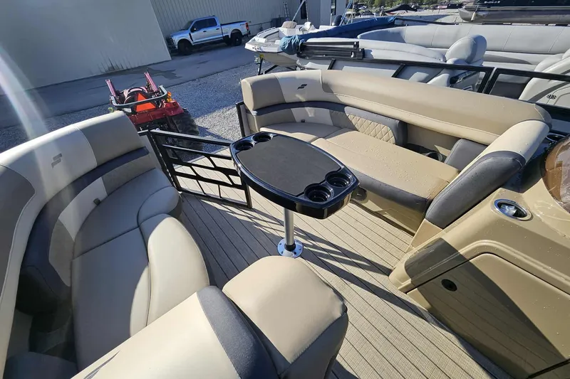 Slide: The Image of Luxurious 2026 Starcraft EXS 3 Q DH boat interior with plush seating and central table. - 4