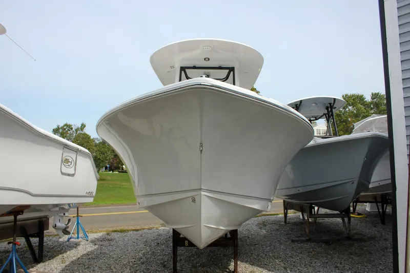Slide: The Image of 2026 Sea Hunt Ultra 235 SE boat on display, front view. - 2