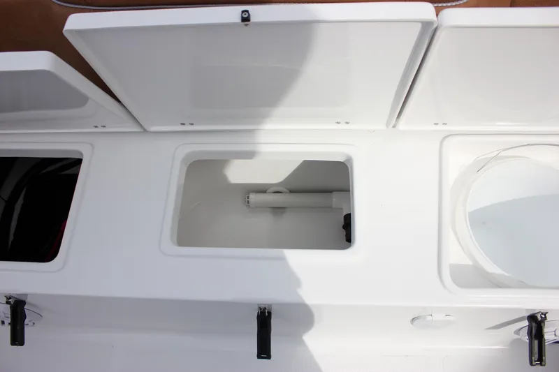 Slide: The Image of Open storage compartments on a 2026 Sea Hunt Ultra 235 SE boat. - 20