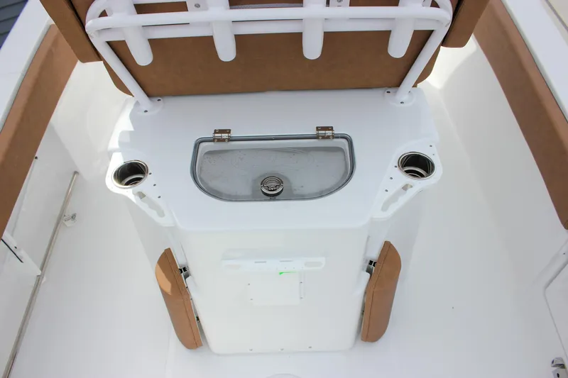 Slide: The Image of 2026 Sea Hunt Ultra 235 SE boat interior with sink and cup holders. - 3