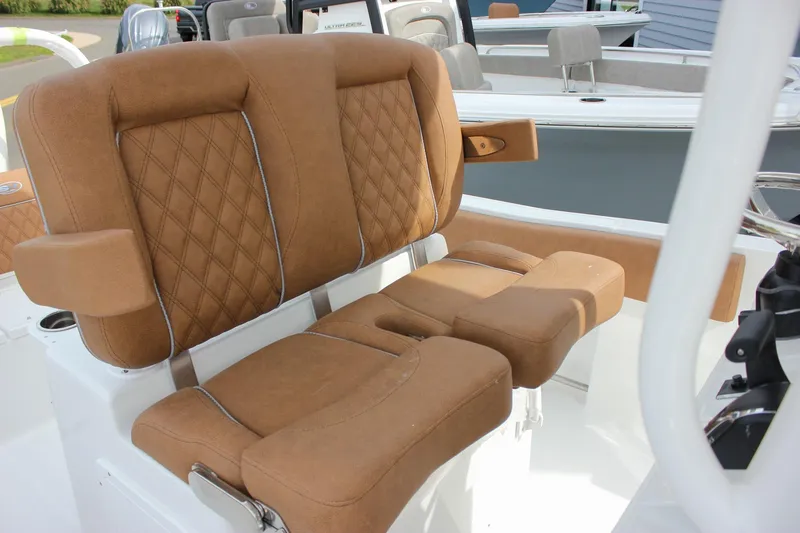 Slide: The Image of Luxurious brown seating on 2026 Sea Hunt Ultra 235 SE boat, featuring diamond stitching. - 37