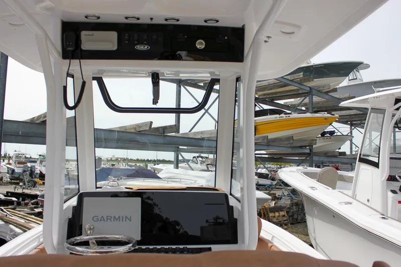 Slide: The Image of Interior view of 2026 Sea Hunt Ultra 235 SE boat with Garmin navigation system. - 4