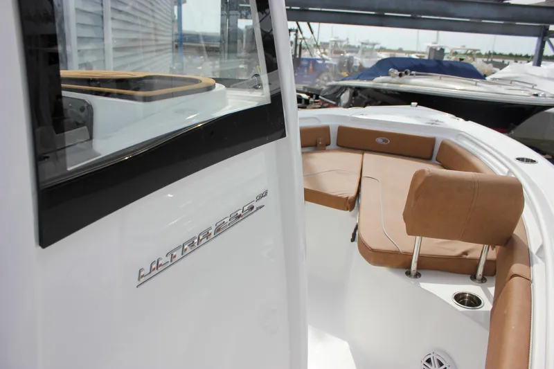 Slide: The Image of 2026 Sea Hunt Ultra 235 SE boat interior with tan seating and sleek design. - 41