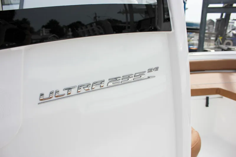 Slide: The Image of 2026 Sea Hunt Ultra 235 SE boat logo on white surface. - 42