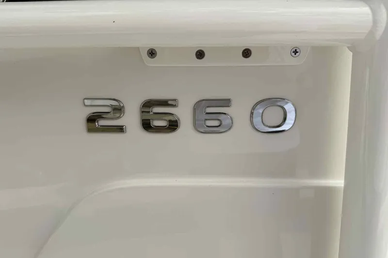 Slide: The Image of Close-up of 2026 Ranger 2660 Bay model emblem on white surface. - 17