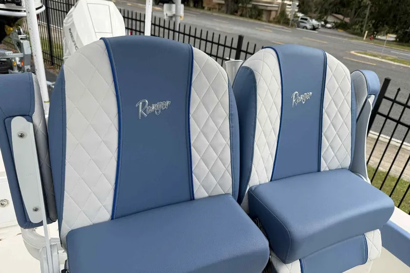 Slide: The Image of 2026 Ranger 2660 Bay boat seats with blue and white quilted design. - 4